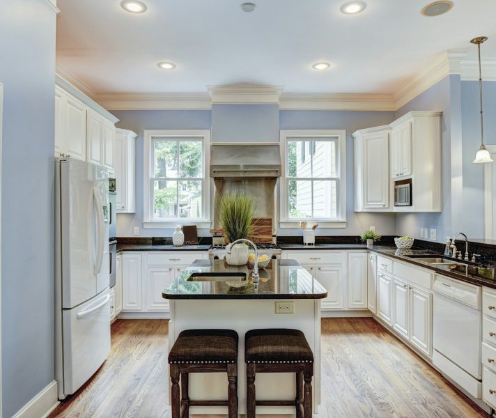 Large American style kitchen interior with granite countertops